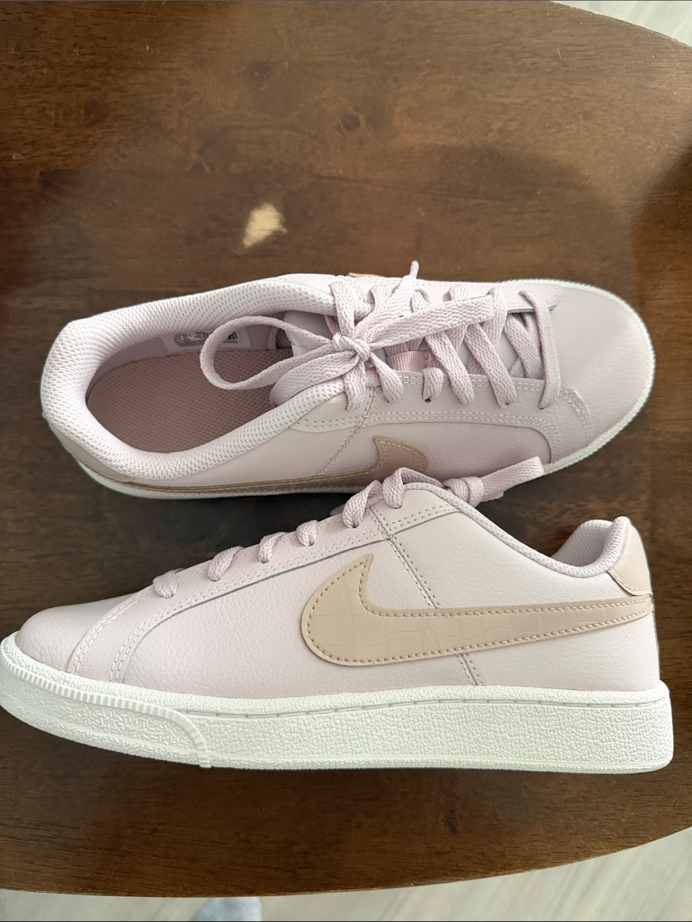 Nike Women's Light Pink Low-Top Sneakers with Beige Swoosh